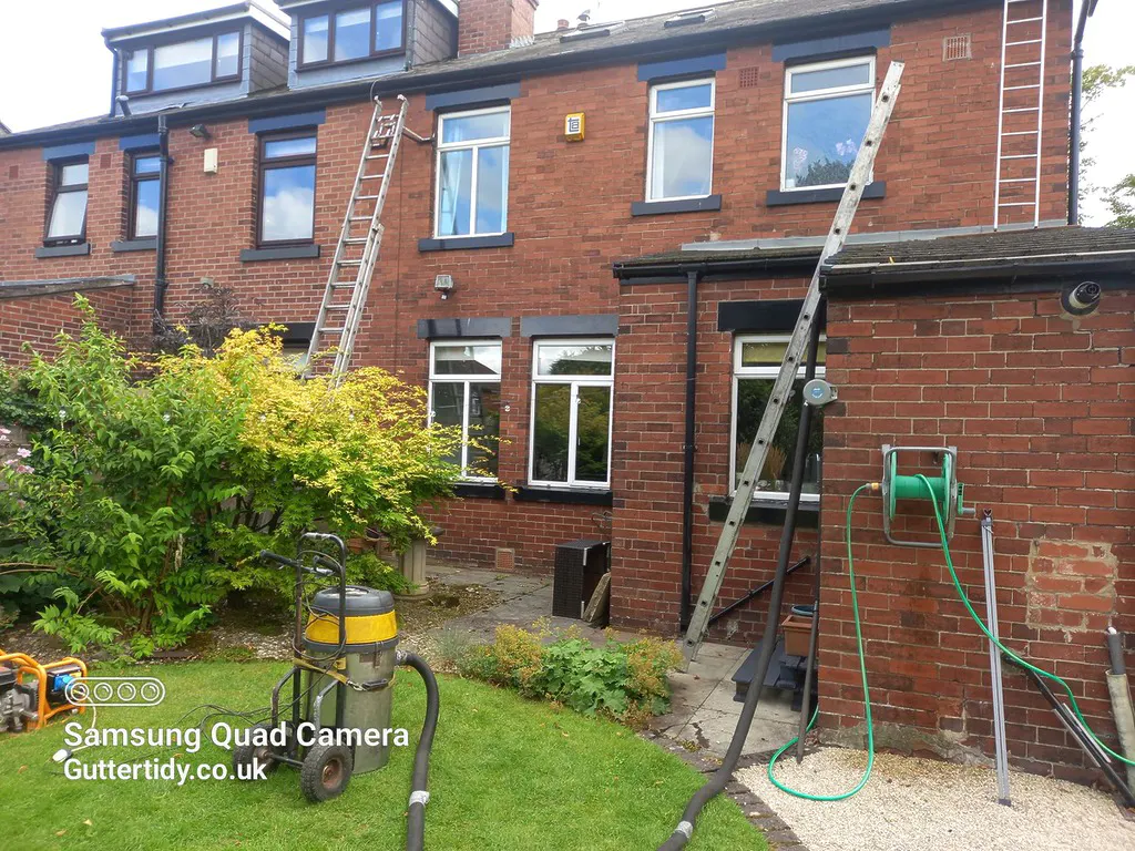Clearing gutters with ladders in Roundhay. some times essential. 