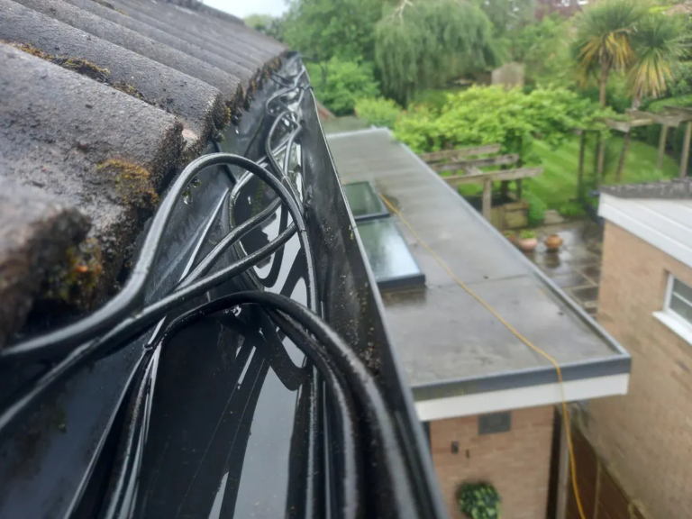 Coaxle cables stuffed into gutter in adel