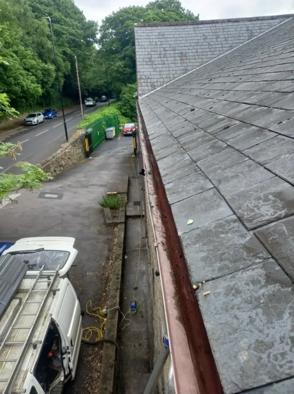 Commercial premises in Horesforth gutters being cleaned. Gutter clearing in Leeds available.