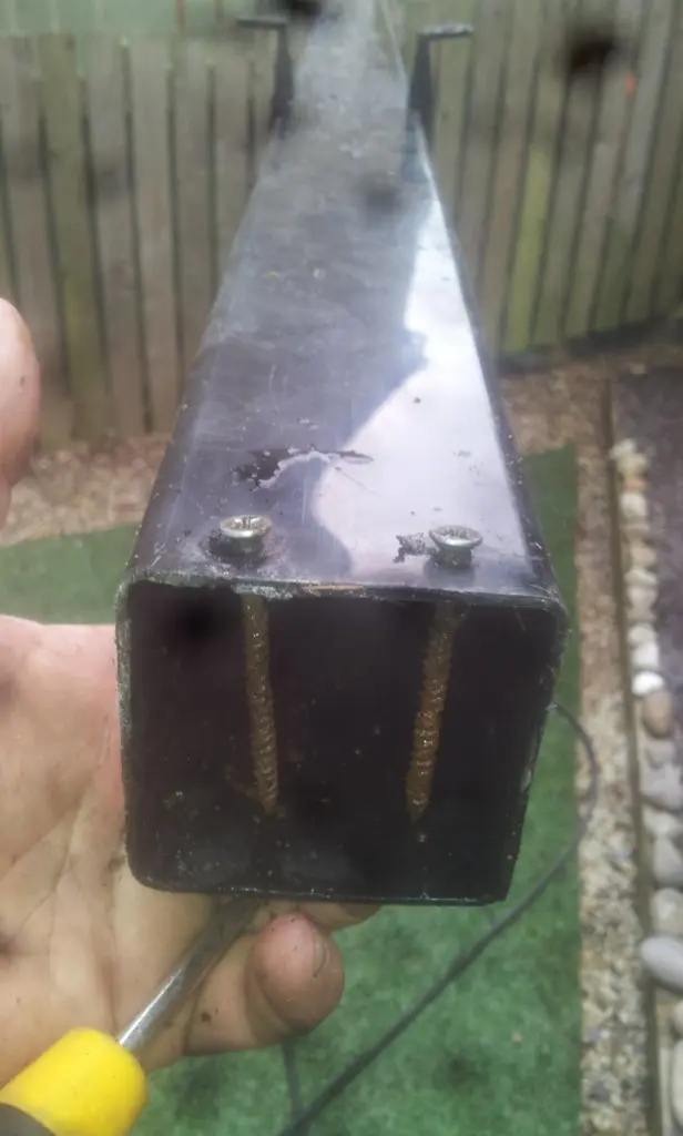 screws through the downpipe in idle gutter clear